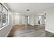 Spacious living area with light gray walls and wood-look flooring at 11592 110Th Ter, Seminole, FL 33778
