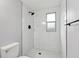 Modern shower with marble tile and glass enclosure at 11592 110Th Ter, Seminole, FL 33778