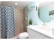 Clean bathroom with a shower/tub combo and white vanity at 12000 Gulf Blvd # 303N, Treasure Island, FL 33706