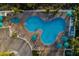 Aerial view of resort-style pool with surrounding lounge areas at 12000 Gulf Blvd # 303N, Treasure Island, FL 33706