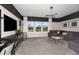 Spacious game room with large sectional sofa and media center at 12652 Glenn Creek Dr, Riverview, FL 33569