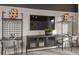 Study with two desks, media console, and wall shelving at 12652 Glenn Creek Dr, Riverview, FL 33569
