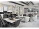 Open concept living space featuring a kitchen island, exposed beams and luxurious finishes throughout at 14638 Swiss Bridge Dr, Lithia, FL 33547