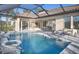 Resort-style pool area with an attached lanai, perfect for relaxation and entertaining at 14638 Swiss Bridge Dr, Lithia, FL 33547