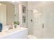Clean bathroom with white vanity, glass shower, and seahorse art at 14814 Paddock Pond Ave, Lithia, FL 33547