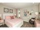 bedroom with pink bedding and whimsical artwork at 14814 Paddock Pond Ave, Lithia, FL 33547