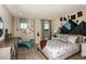 bedroom with climbing wall decor and patterned bedding at 14814 Paddock Pond Ave, Lithia, FL 33547