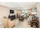 Spacious bonus room with comfortable seating, a TV, and plenty of natural light at 14814 Paddock Pond Ave, Lithia, FL 33547