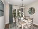 Elegant dining room with chandelier, large mirror, and six chairs at 14814 Paddock Pond Ave, Lithia, FL 33547