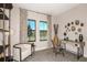 Home office with window views, comfortable seating, and a workspace at 14814 Paddock Pond Ave, Lithia, FL 33547