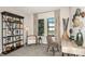 Bright home office features built-in shelving, a comfortable chair, and a workspace at 14814 Paddock Pond Ave, Lithia, FL 33547