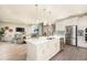 Open concept kitchen with large island and stainless steel appliances at 14814 Paddock Pond Ave, Lithia, FL 33547