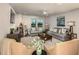 Spacious living room featuring comfortable seating and large windows at 14814 Paddock Pond Ave, Lithia, FL 33547