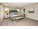 Large main bedroom with a king-size bed and ensuite bathroom access at 14814 Paddock Pond Ave, Lithia, FL 33547