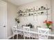 Charming study area with floating shelves, three chairs, and a long countertop at 14814 Paddock Pond Ave, Lithia, FL 33547