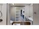 Bathroom with modern barn door and updated vanity at 1501 Gulf Blvd # 104, Clearwater Beach, FL 33767