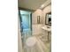 Bathroom with pedestal sink and laundry in the same room at 1501 Gulf Blvd # 104, Clearwater Beach, FL 33767