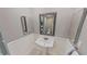 Guest bathroom with pedestal sink and ornate mirror at 1501 Gulf Blvd # 104, Clearwater Beach, FL 33767