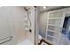 Bathroom featuring a shower, toilet and barn door at 1501 Gulf Blvd # 104, Clearwater Beach, FL 33767