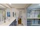 Main bathroom with vanity, large mirror and walk-in closet at 1501 Gulf Blvd # 104, Clearwater Beach, FL 33767