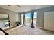Bright bedroom with water view and access to balcony at 1501 Gulf Blvd # 104, Clearwater Beach, FL 33767