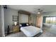 Bedroom with a murphy bed, water views, and built-in shelves at 1501 Gulf Blvd # 104, Clearwater Beach, FL 33767