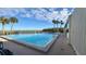 Inviting community pool with surrounding patio at 1501 Gulf Blvd # 104, Clearwater Beach, FL 33767