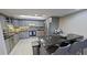 Modern kitchen with breakfast bar and stainless steel appliances at 1501 Gulf Blvd # 104, Clearwater Beach, FL 33767