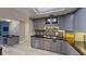 Modern kitchen with stainless steel appliances and granite countertops at 1501 Gulf Blvd # 104, Clearwater Beach, FL 33767