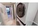 Stackable washer and dryer in a small laundry room at 1501 Gulf Blvd # 104, Clearwater Beach, FL 33767