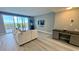 Spacious living room with water view and modern decor at 1501 Gulf Blvd # 104, Clearwater Beach, FL 33767