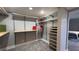 Large walk-in closet with custom shelving and drawers at 1501 Gulf Blvd # 104, Clearwater Beach, FL 33767