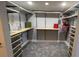 Spacious walk-in closet with ample shelving and drawers at 1501 Gulf Blvd # 104, Clearwater Beach, FL 33767