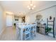 Bright dining area with a white table and gray chairs at 1621 Eagle Creek Dr, Clearwater, FL 33764