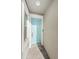 Light teal front door and brick-patterned flooring in the entryway at 1621 Eagle Creek Dr, Clearwater, FL 33764