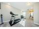 Upper level home gym with treadmill and weights at 1621 Eagle Creek Dr, Clearwater, FL 33764