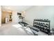 Home gym featuring a treadmill and dumbbell rack at 1621 Eagle Creek Dr, Clearwater, FL 33764