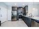 Modern kitchen with dark gray cabinets and stainless steel appliances at 1621 Eagle Creek Dr, Clearwater, FL 33764