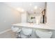 Modern kitchen features a breakfast bar with seating and sleek countertops at 1621 Eagle Creek Dr, Clearwater, FL 33764