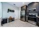 Modern kitchen features stainless steel appliances and gray cabinets at 1621 Eagle Creek Dr, Clearwater, FL 33764