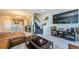 Open living room with brown leather sectional and staircase at 1621 Eagle Creek Dr, Clearwater, FL 33764