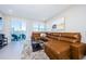 Relaxing living room with sectional sofa and sliding glass doors at 1621 Eagle Creek Dr, Clearwater, FL 33764