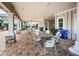 Covered patio area with tables and chairs near the pool at 1621 Eagle Creek Dr, Clearwater, FL 33764