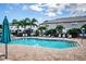 Community pool with surrounding lounge chairs and patio at 1621 Eagle Creek Dr, Clearwater, FL 33764