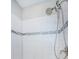 Shower with tile surround and modern shower head at 1621 Eagle Creek Dr, Clearwater, FL 33764