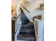 Elegant dark wood staircase with simple railing at 1621 Eagle Creek Dr, Clearwater, FL 33764