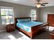 Bright bedroom featuring a king-size bed and wood furniture at 17241 Old Tobacco Rd, Lutz, FL 33558