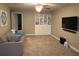 Spacious bonus room with comfortable seating and built-in shelving at 17241 Old Tobacco Rd, Lutz, FL 33558