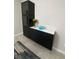 Modern black built-in shelving unit with white top at 17241 Old Tobacco Rd, Lutz, FL 33558