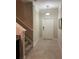 Clean entryway with tiled flooring and staircase at 17241 Old Tobacco Rd, Lutz, FL 33558